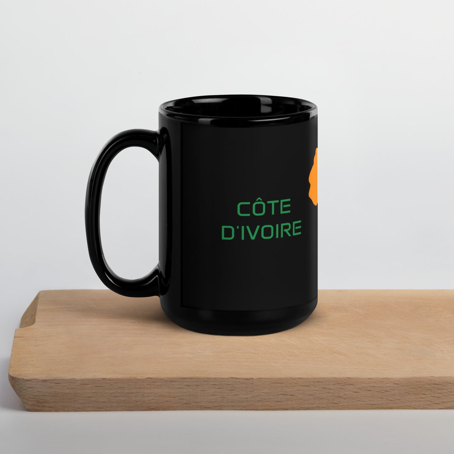 Cote dIvoire flag ceramic mug showing handle and print detail.
