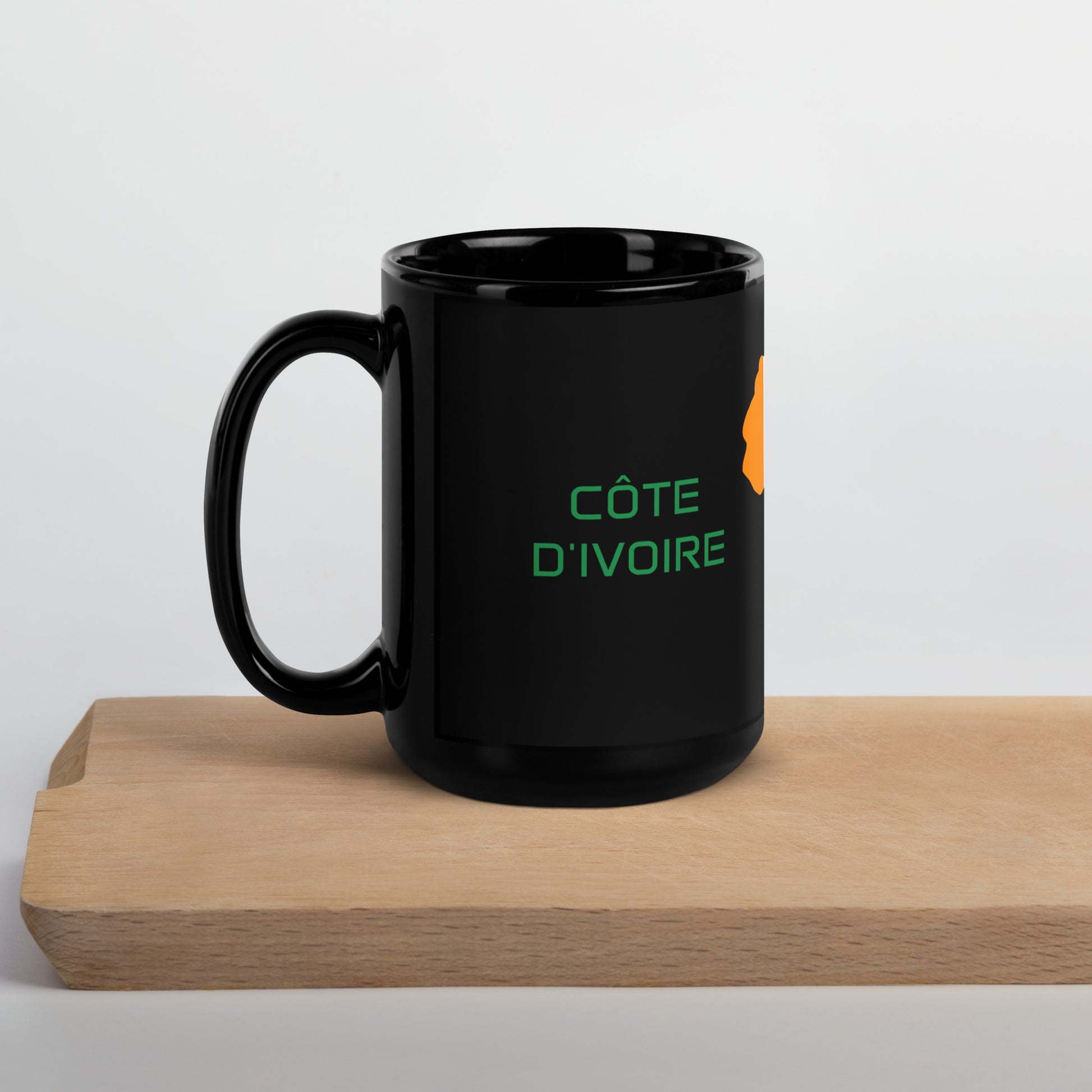 Cote dIvoire flag ceramic mug showing handle and print detail.
