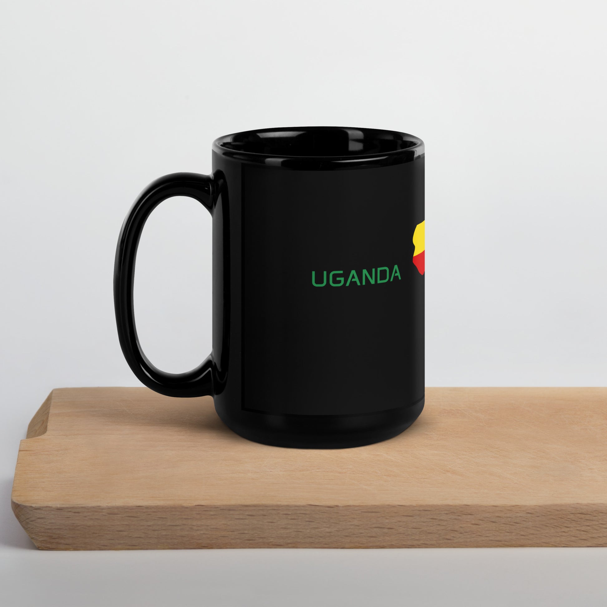 Uganda flag ceramic mug showing handle and print detail.